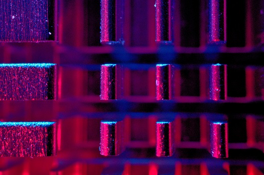 Abstract image shows set of acrylic squares, with neon lights in shades of blue and purple (Image: Michael Dziedzic/Unsplash)